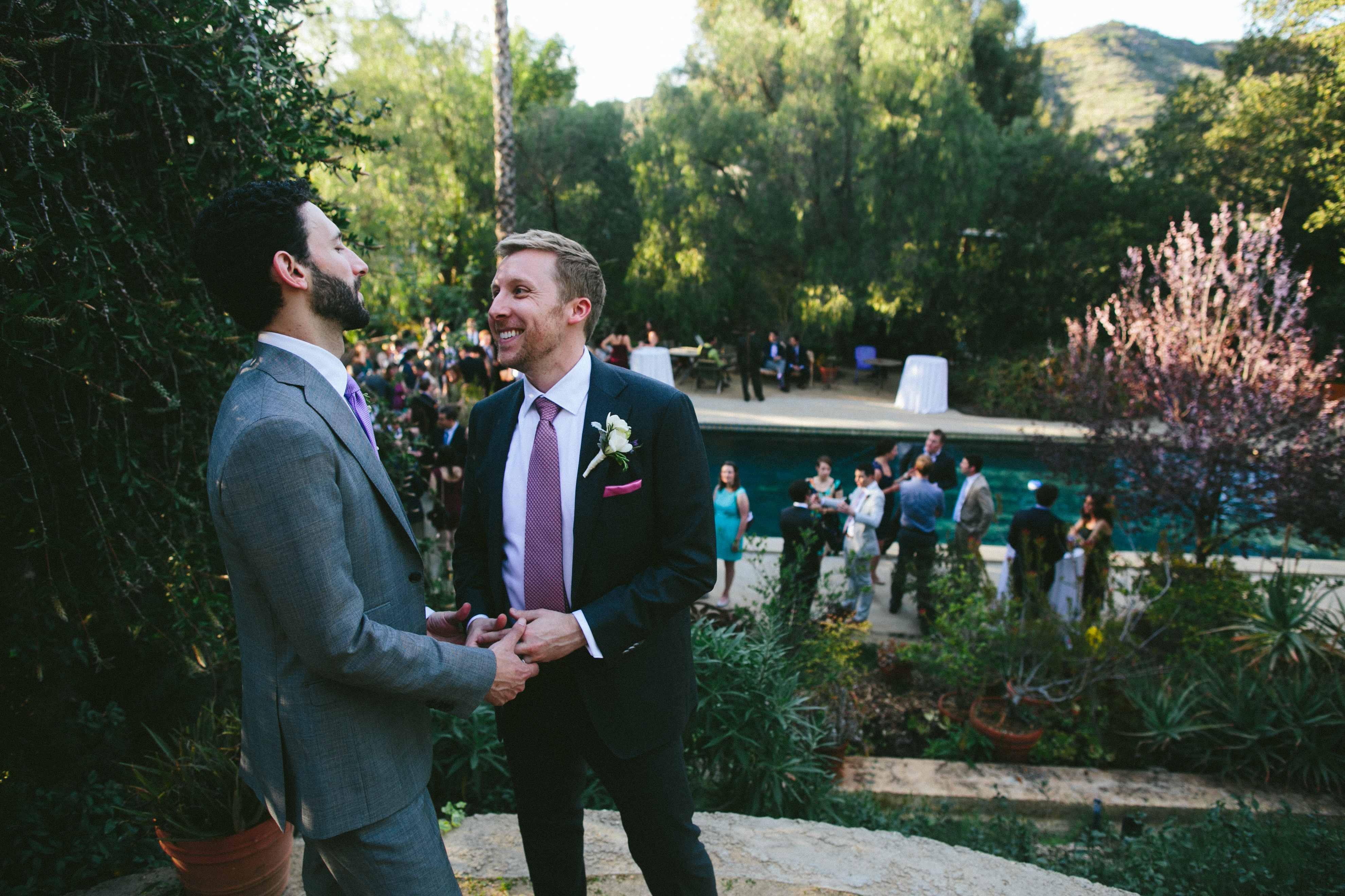 Two grooms holding hands. Same sex wedding. LGBTQ wedding. Gay wedding. Moxie Bright Events