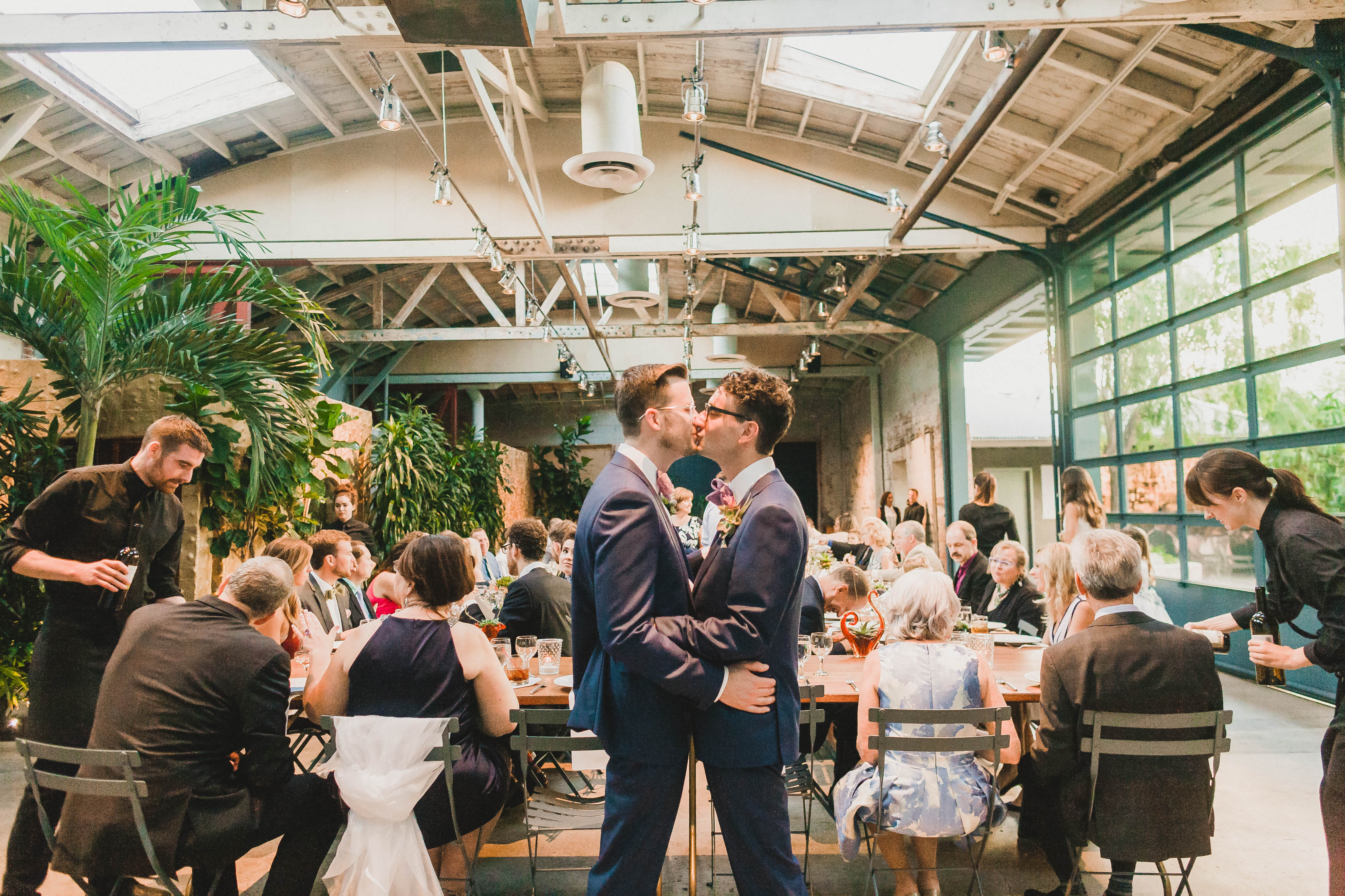Los Angeles Wedding Planner, two grooms kiss at Millwick, downtown Los Angeles, Moxie Bright Events wedding