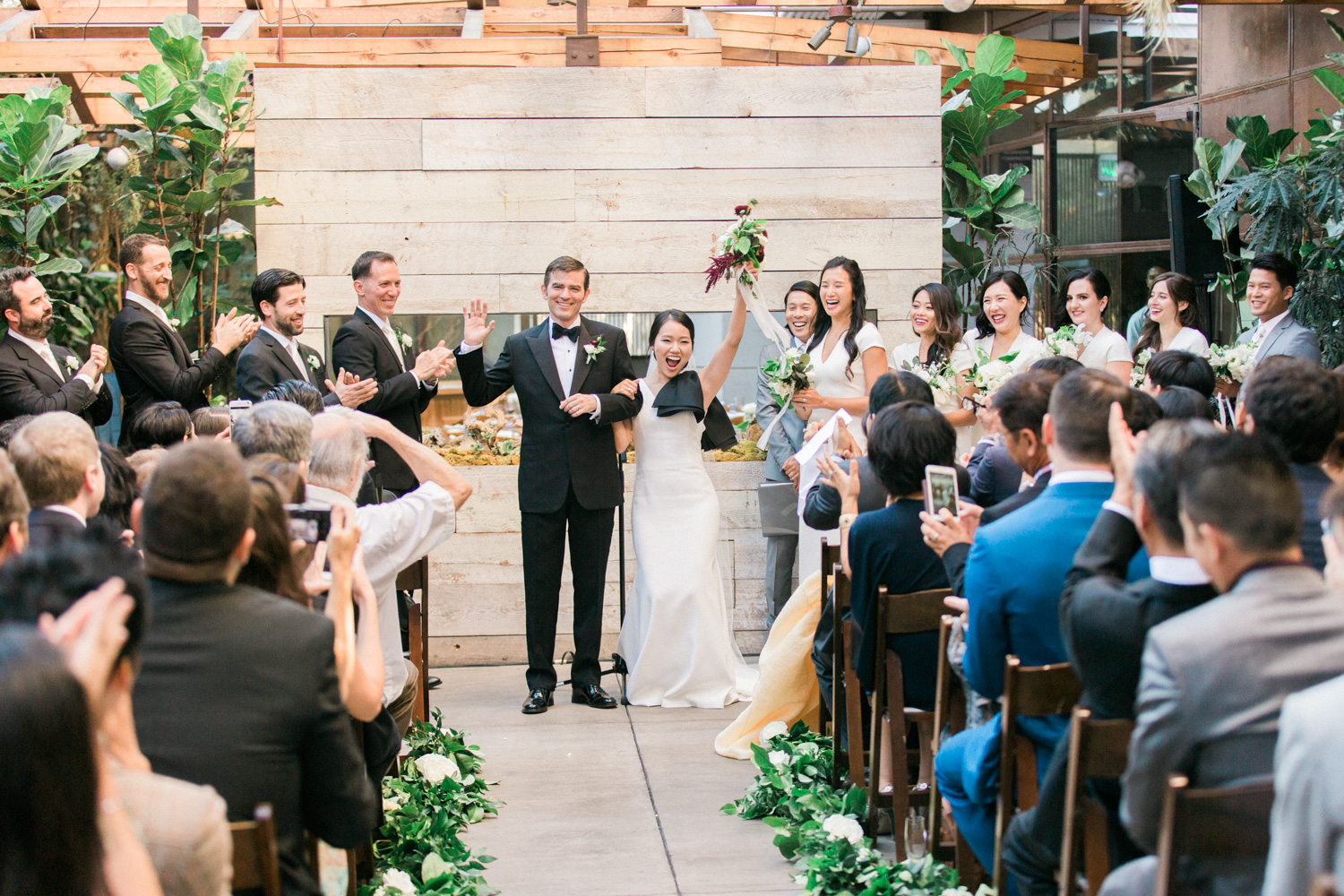 bride and groom celebrate after wedding ceremony at Hinoki & the Bird wedding, Moxie Bright Events